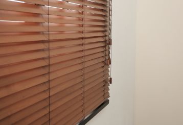 Faux Wood Blinds in a Sunlit Room